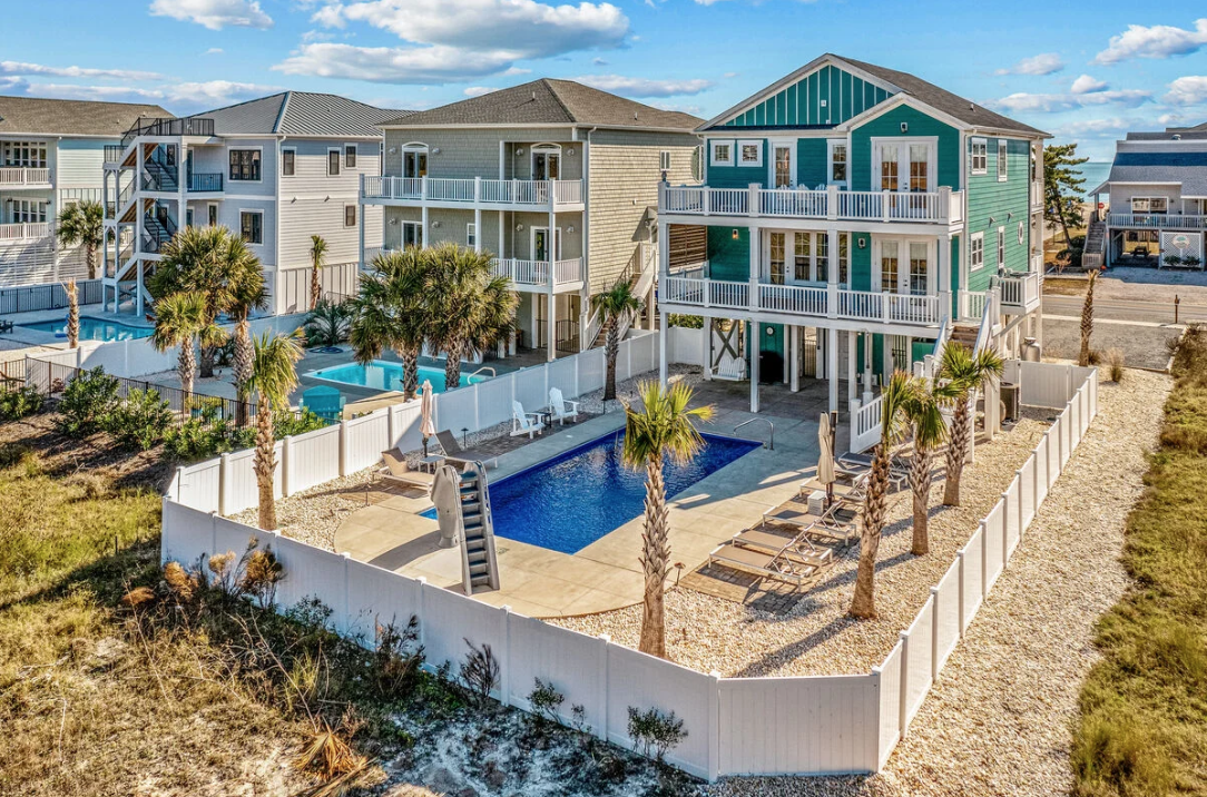 Aerial view of the fenced pool and backyard