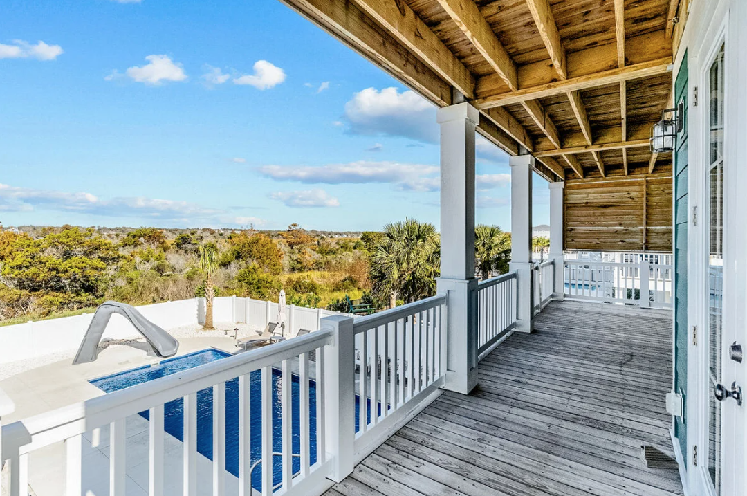 Rear porch overlooking the pool and marsh