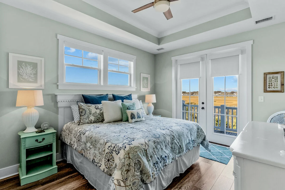 Master bedroom with king bed and marsh views