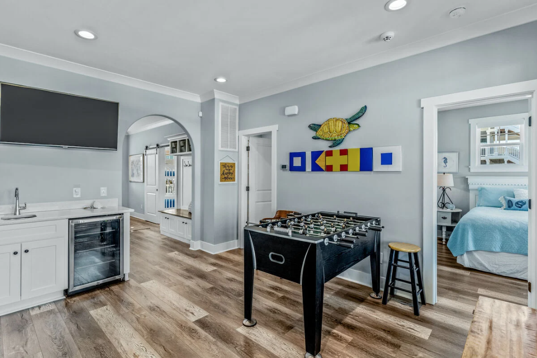 Downstairs game room with foosball table and wet bar