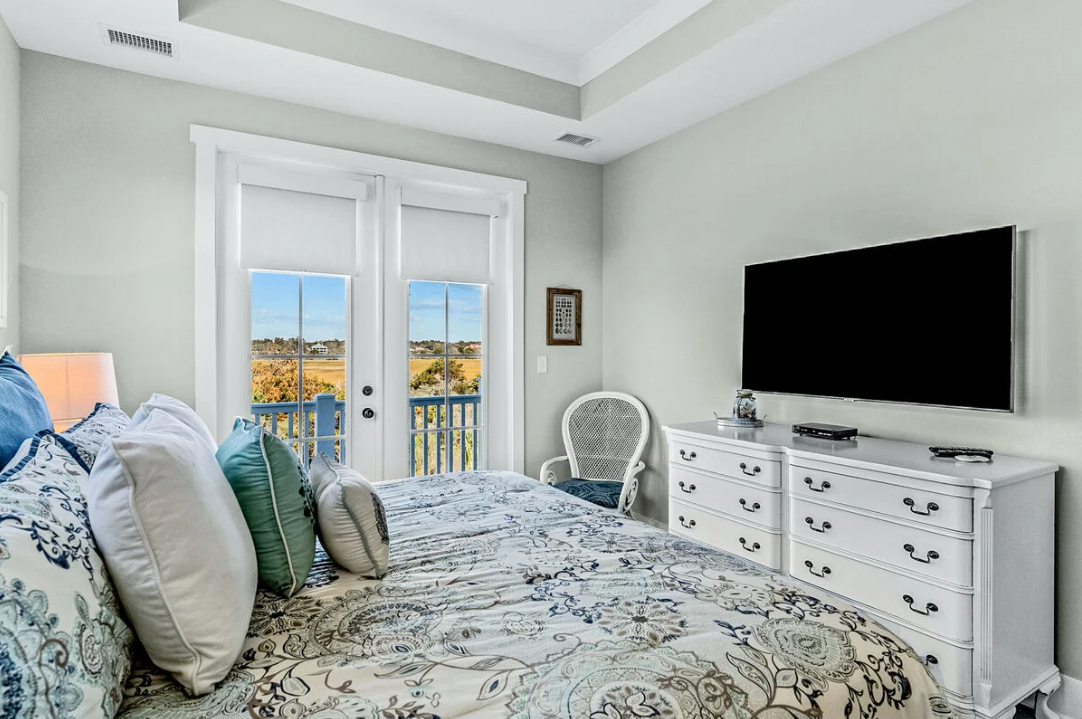 Master bedroom with TV and dresser