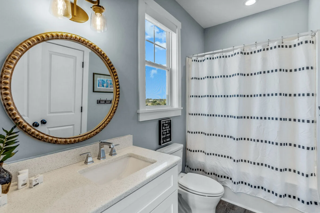 Bunk bedroom bathroom with vanity and shower