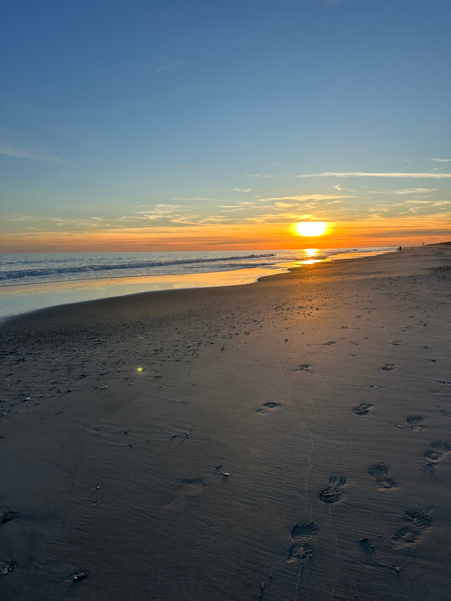 Sunrise reflecting on wet sand