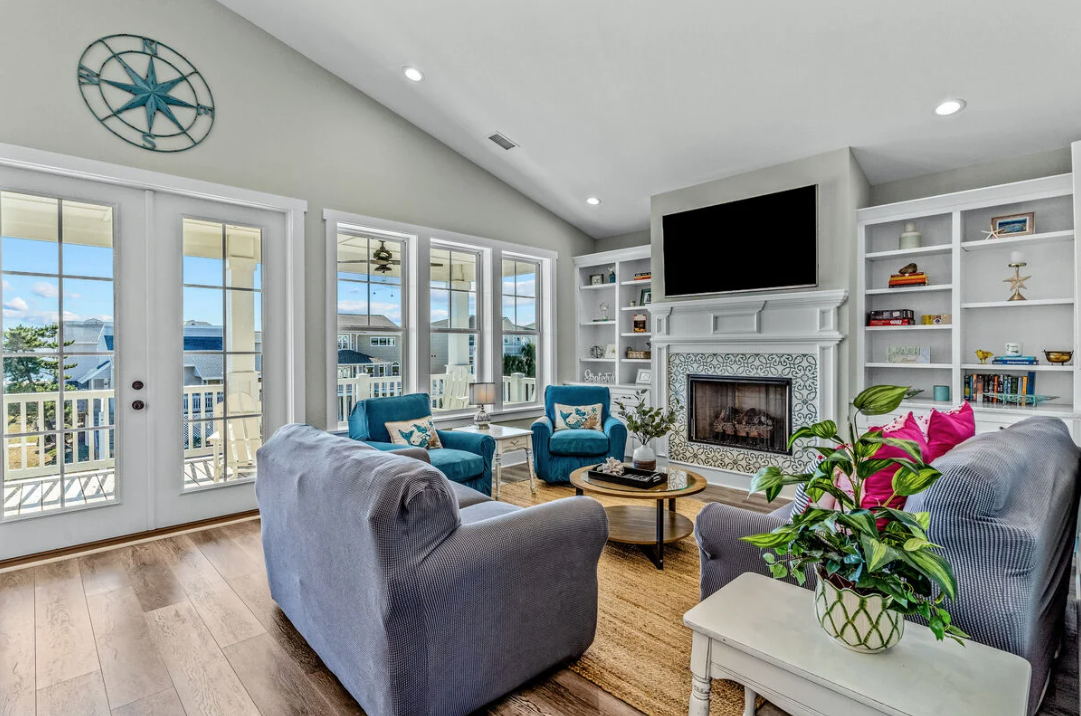 Living room with fireplace and ocean views